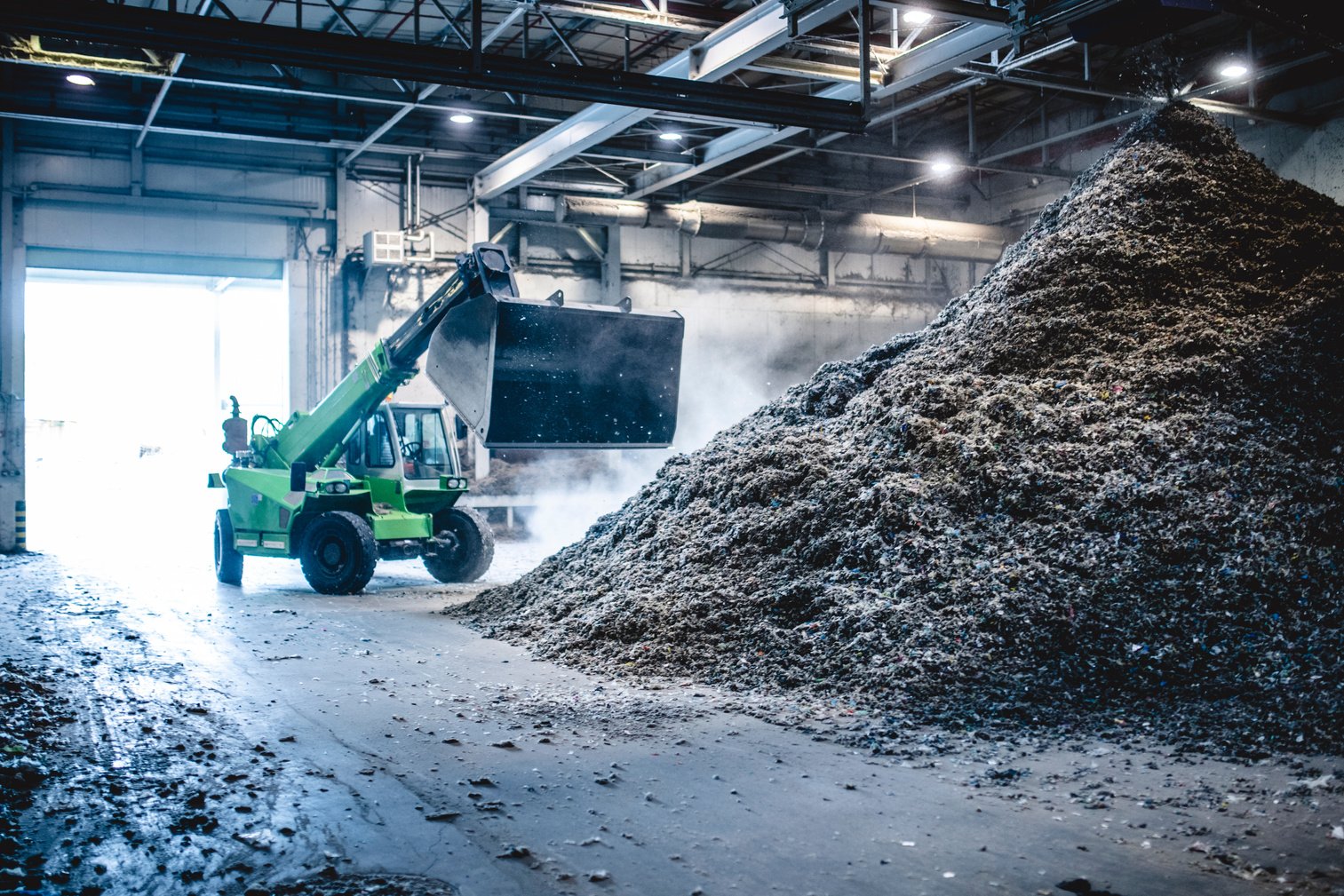 Heavy Machinery Managing Recyclables in Waste Facility